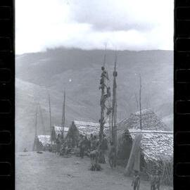 Men Climbing Food Pole