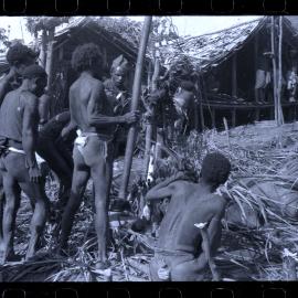 Men Preparing for a Ceremony