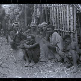 Group Sitting Outside a Building