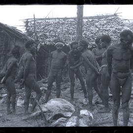 Group Gathered Outside Buildings