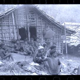 Group Sitting Outside a Building