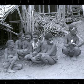 Group of Women Sitting Outside a Building