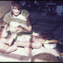 Woman Feeding Baby