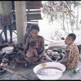 Women and Children Around Cooking Fire