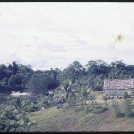 Buildings on Riverbank, with Seaplane in Background