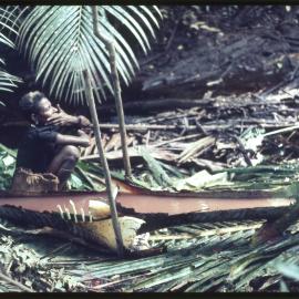 Woman Beside Felled Sago Palm