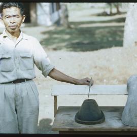 Man Standing Beside Ceramics