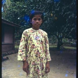 Girl Standing in Garden