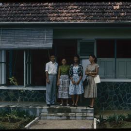 Group Standing Outside a House