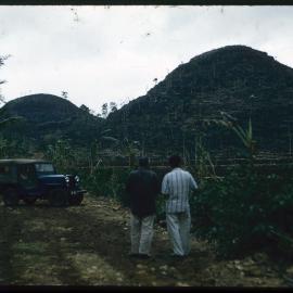 Two Men Standing by Terraced Landscape