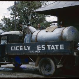 Men Standing on Cicely Estate Truck, Malaysia