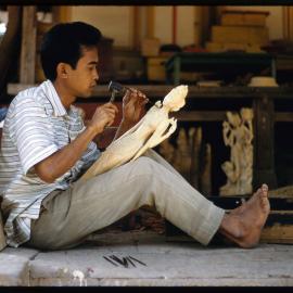Man Carving Wooden Figure
