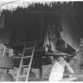 Women by Wooden Structure on Stilts