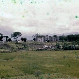View Across Field with Buildings in Background