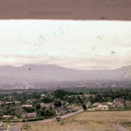 View of Buildings with Mountains in Background