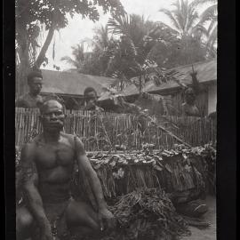 [Manum Island, New Guinea] Man of Awar with the New Gong Brought from Awar to the Plantation