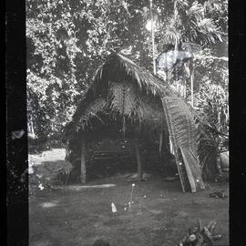 [Manum Island, New Guinea] The Back of the Same Hut After the Wall has Been Removed to Make Room for the Mourners