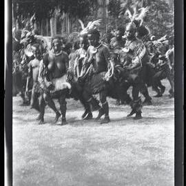 [Manum Island, New Guinea] The Men and Women of Kayan Dance in a Ring