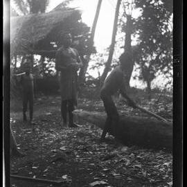 [Manum Island, New Guinea] A Lad Making a Canoe for Himself