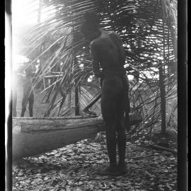 [Manum Island, New Guinea] Zabe Shaping the Head of the new Canoe Preparatory to Carving it