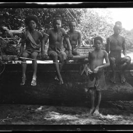 [Manum Island, New Guinea] The Same Group of People with Paisirua and Tsagera'a of Waia Sitting on the Punoŋ Canoe