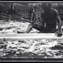 [Manum Island, New Guinea] Arorŋabia Preparing a Plank for the Perapera of MBs [Mamboti] Canoe