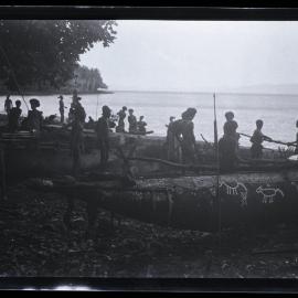 [Manum Island, New Guinea] Men Adjusting the iadzo on Yabururu’s Canoe