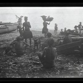 [Manum Island, New Guinea] Mamboti’s Canoe. Women Bringing Food for the Workers on the Beach