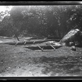 [Manum Island, New Guinea] The Canoe House of Mamboti with some Fishing Canoes Drawn up near by