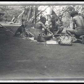 [Manum Island, New Guinea] Aimoŋ and Others Scraping Coconuts