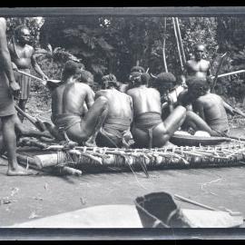 [Manum Island, New Guinea] Packing the tapa’a into the Wild Banana Leaves