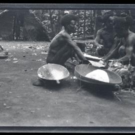 [Manum Island, New Guinea] Yabu and Two Others Mixing the Sago and Grated Coconut