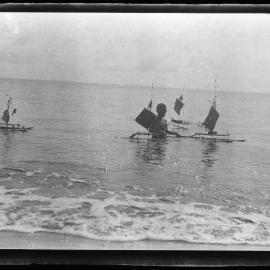 [Manum Island, New Guinea] Little Boys of Waia Playing in the Sea with Toy Canoes