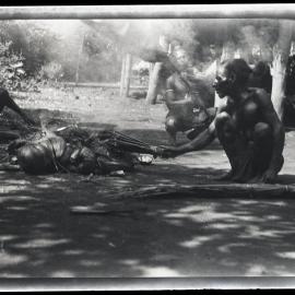 [Manum Island, New Guinea] Drying the Wild Banana Leaves over a Smokey Fire 