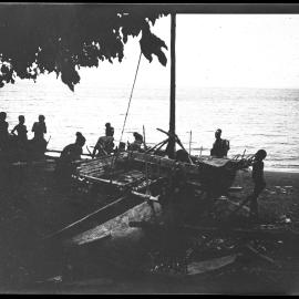 [Manum Island, New Guinea] Beginning to Haul the Canoe Down to the Waters Edge