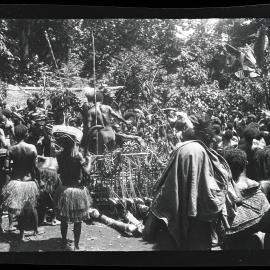 [Manum Island, New Guinea] Throwing the Bananas out of the Big Bed of Food