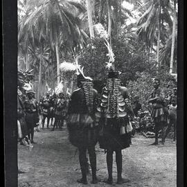 [Manum Island, New Guinea] The Back View of the Two Girl Dancers in Awar, Showing their Orna­ments