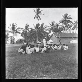 [Narau] The Scouts Yarning with their Friends after the Parade. The Man Standing up is Head-teacher Aroi