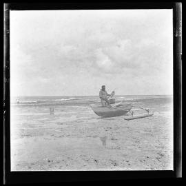 [Narau] A Fisherman About to Carry his Canoe over the Reef to Launch it in Deep Water