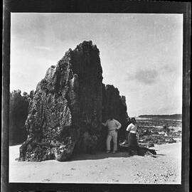 [Narau] Detudamo and Denea Beside One of the Large Stones on the Beach at the North End of Anibari Bay