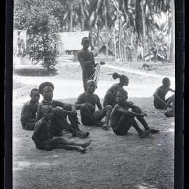 [Manum Island, New Guinea] Men of (?) Nubia Watching the Dancing at Awar Plant[atio]n