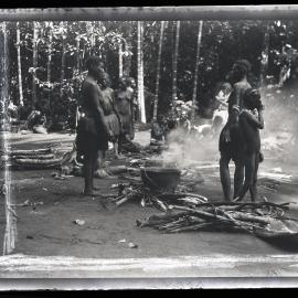 [Manum Island, New Guinea] Watching the Pig Cook