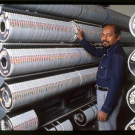 Staff Member with Rows of Audio-Visual Material