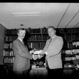 Dr Neil Radford Receiving Books from Edward Schreyer, Canadian High Commissioner