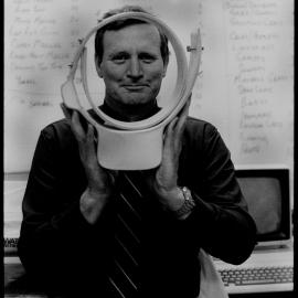 Associate Professor Gordon Grigg with Radio Tracking Collar for Camels