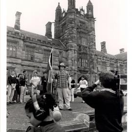 Bill Elwood, Indigenous Member of the SRC Planting the Aboriginal Flag on the Front Lawn