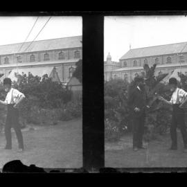 Two Men on University Grounds with Macleay Museum in the Background